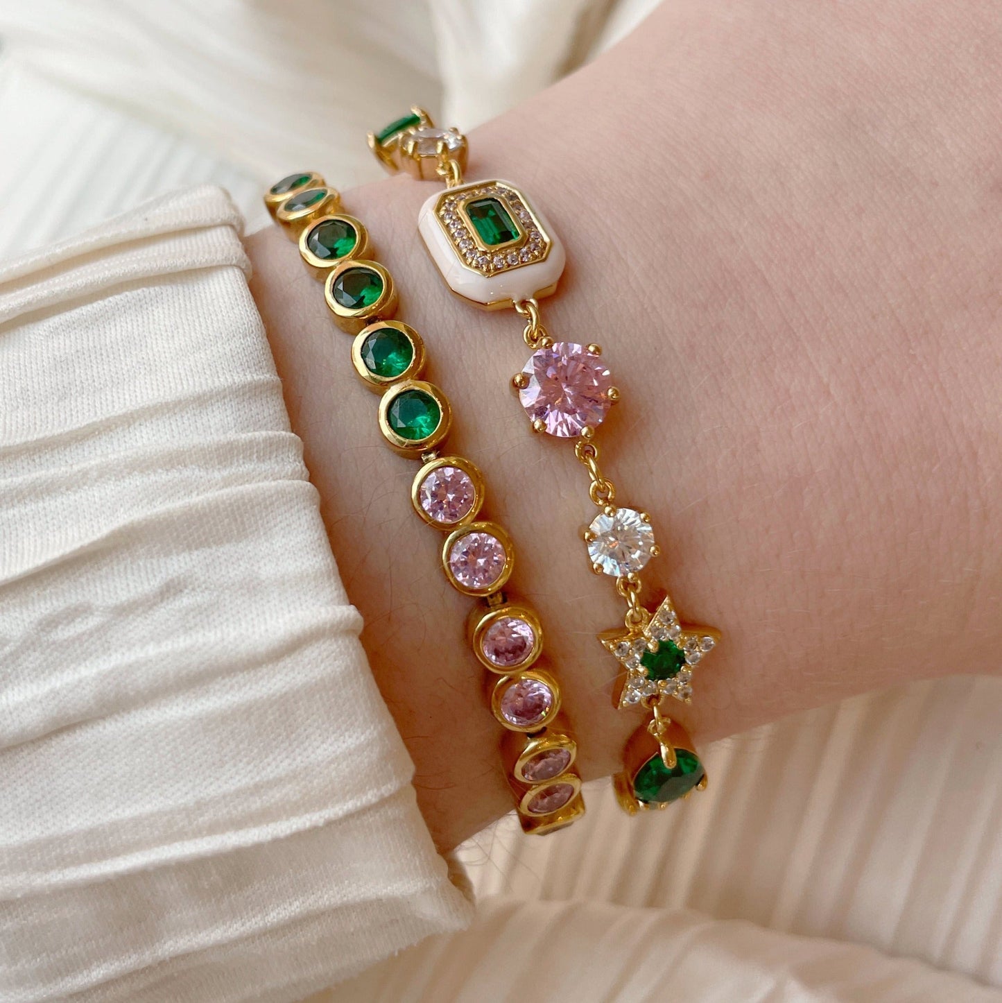 Colourful Tennis Bracelet, Dotty Blush Pink, Emerald Green & Gold on the wrist styled in a stack