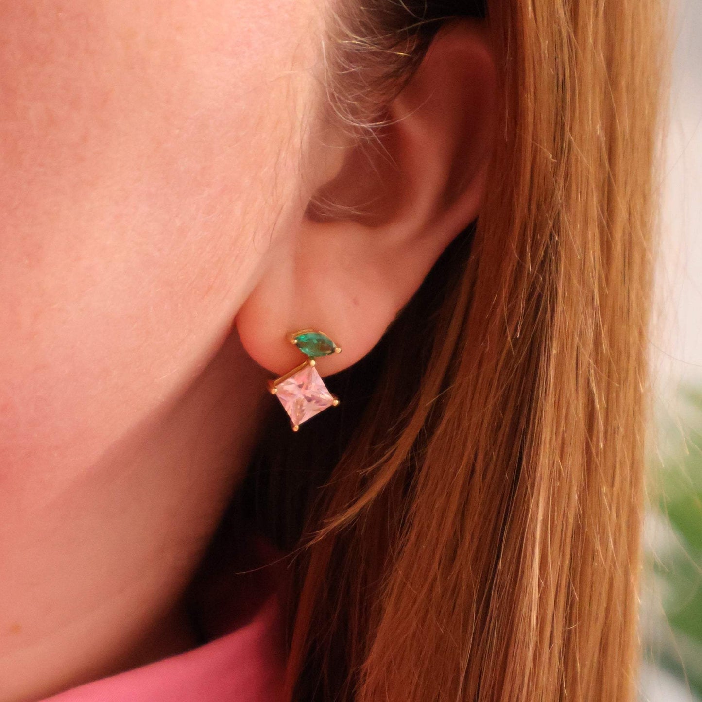 Unusual gold earrings. Striking emerald green and pink cubic zirconia stud earrings with 18k gold plating in ear