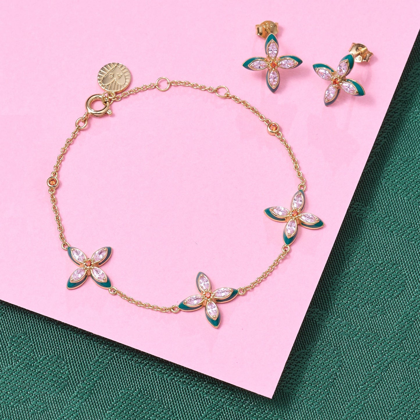 Lucky Clover Jewellery gold bracelet and stud earrings set with lab grown cubic zirconia and green enamel clover motifs