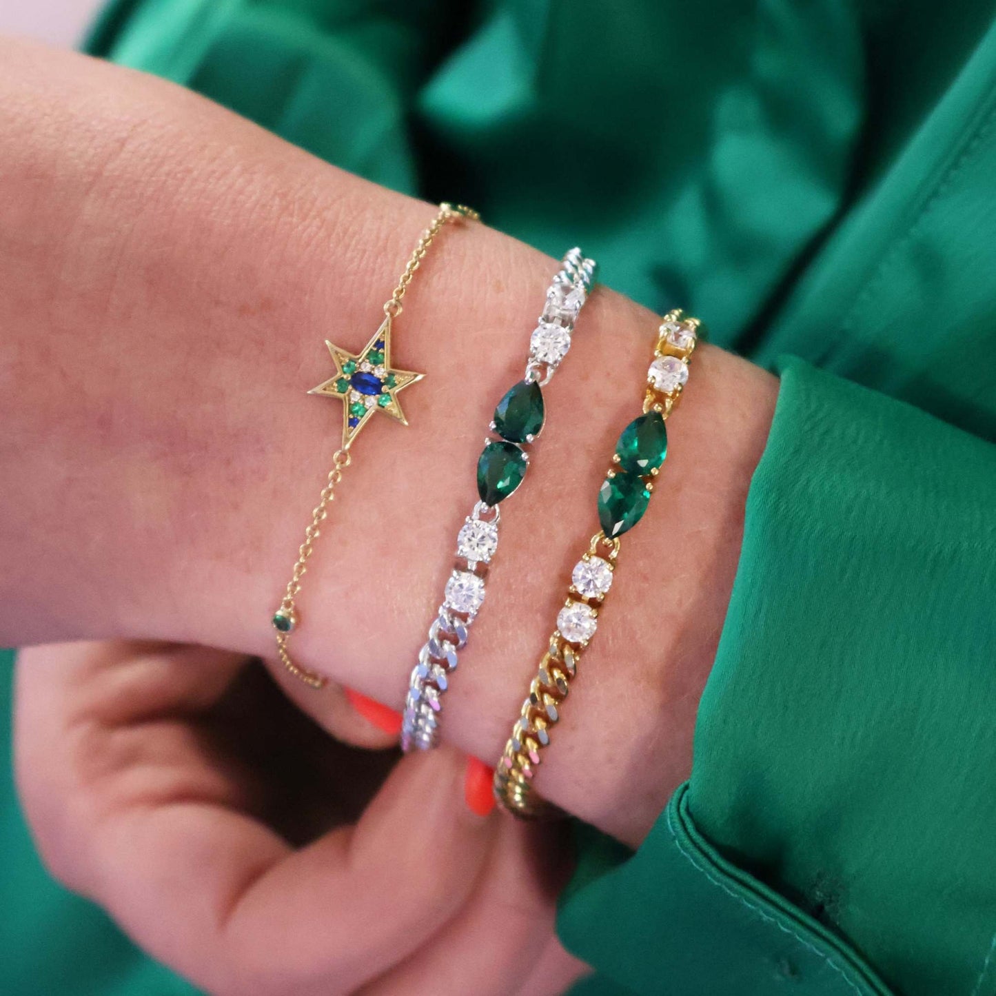 Mixed metal stacking bracelets, nova north star chain style with emerald green, sapphire, silver and gold styles.