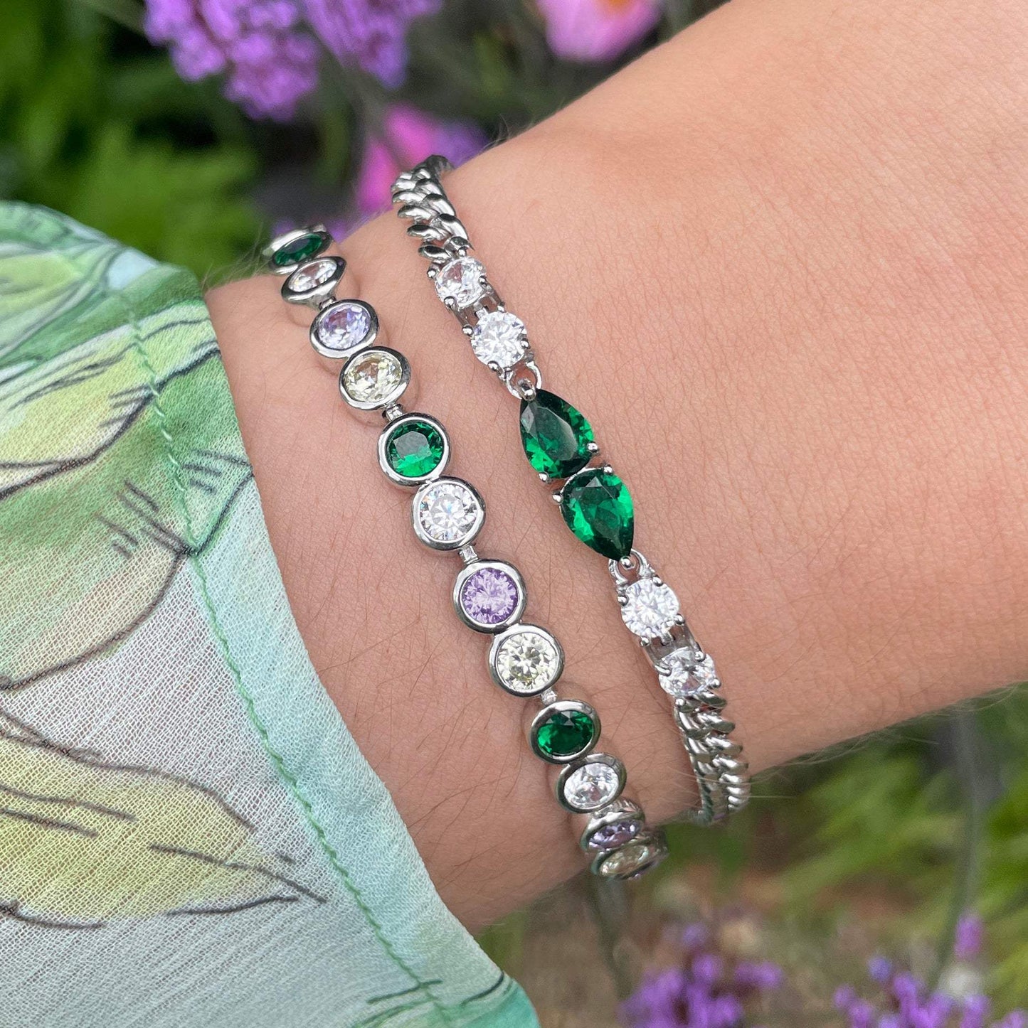 Sofia Teardrop Bracelet emerald green and silver cubic zirconia on silver plated chain worn on wrist with complementary bracelets