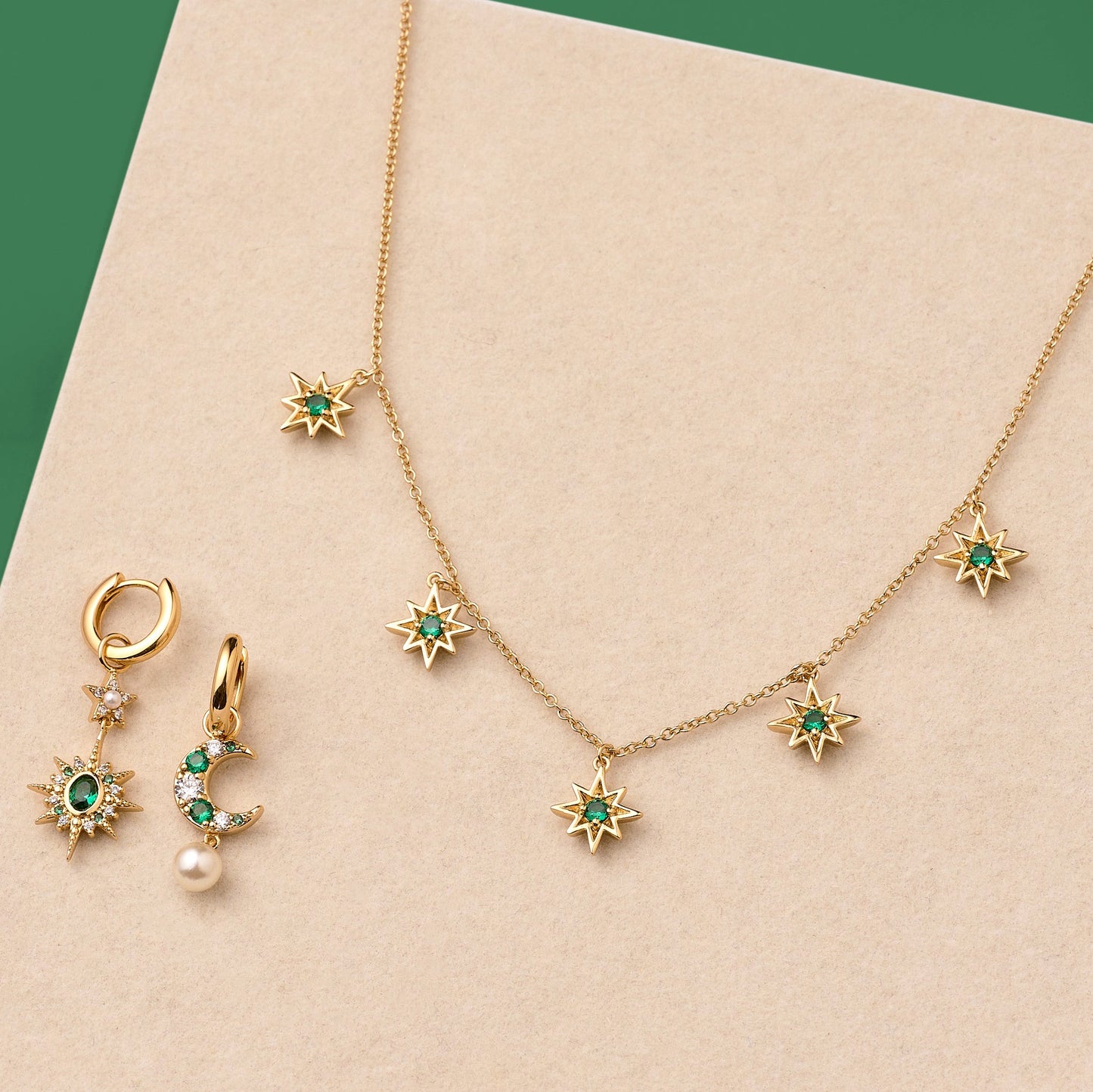 Luna & Ziggy North Star gold plated necklace and emerald green embellished huggie hoop earrings gift set