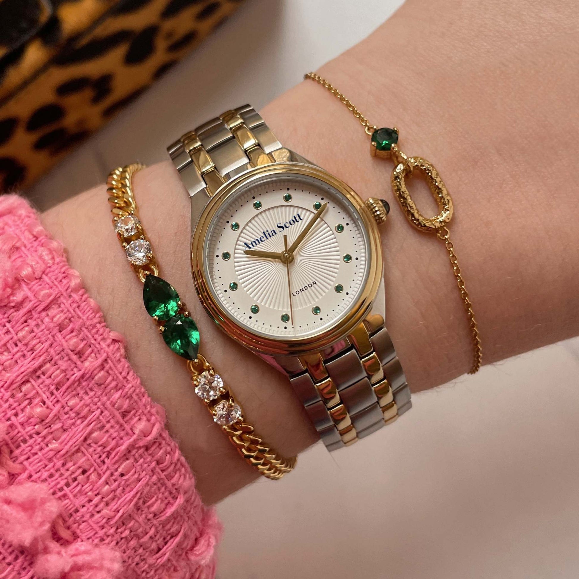 Ava Vintage Two Tone silver and gold bracelet watch with emerald green markers on wrist